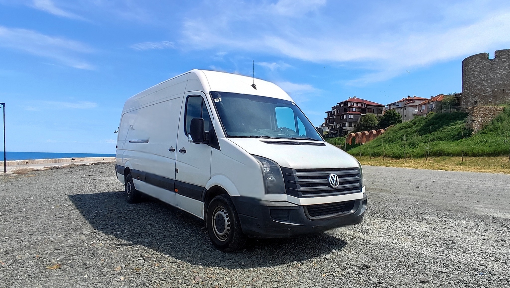 Professional moving team and large moving van